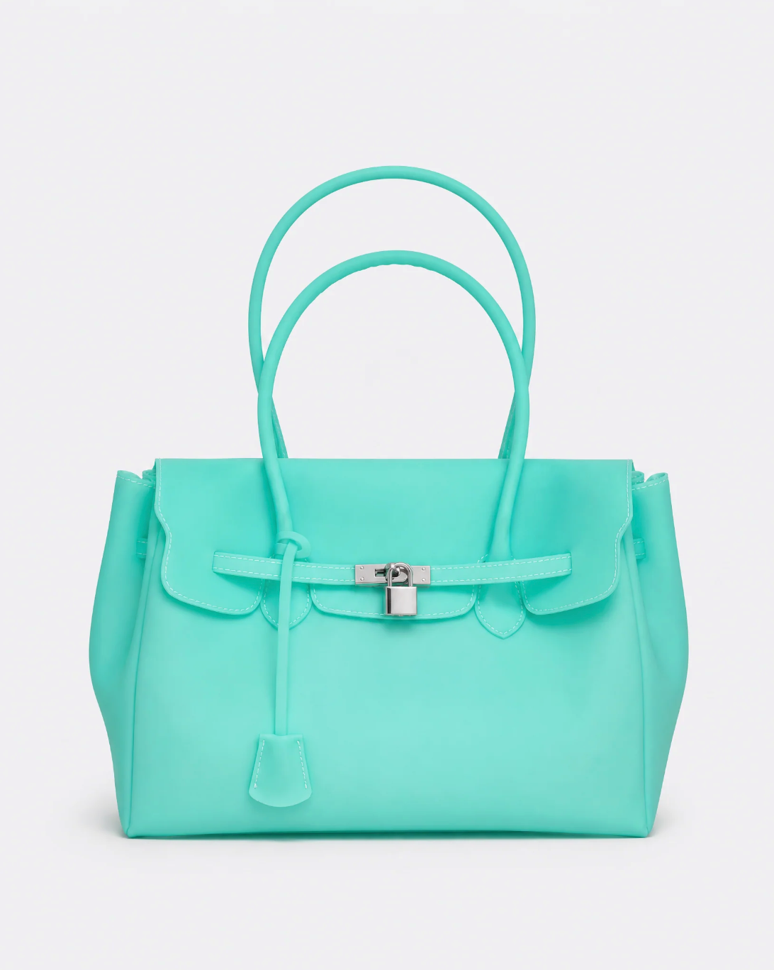 A structured turquoise handbag with double top handles, a front flap, and a silver turn-lock closure